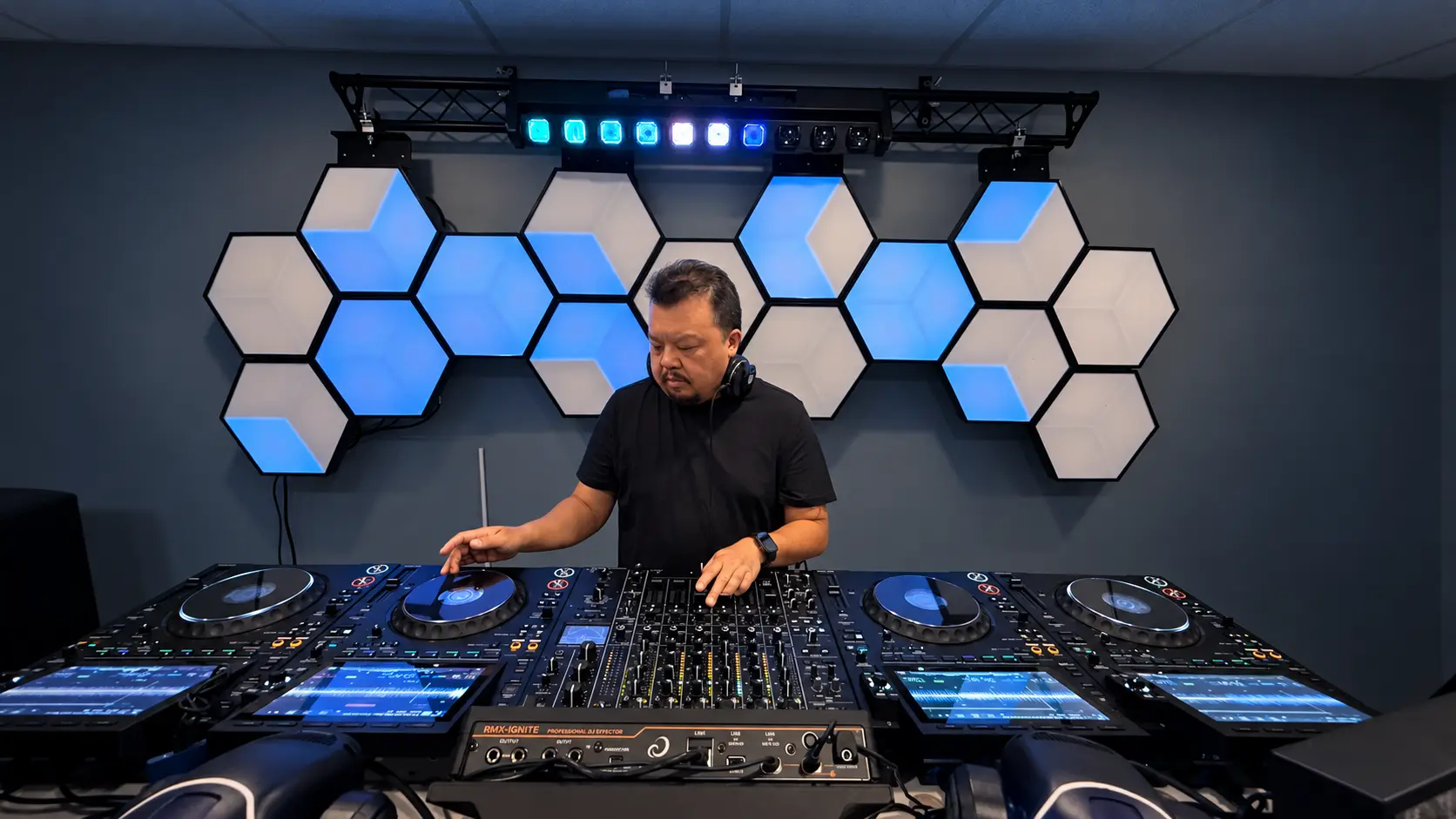 dejafua focused on the mix behind four CDJs